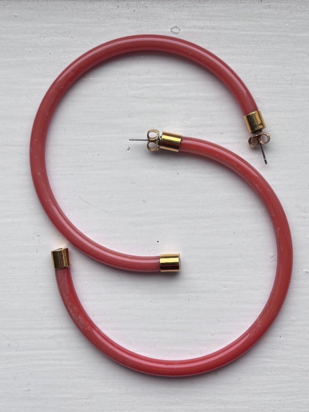 Rachel Comey large acrylic hoop earrings in peachy terracotta